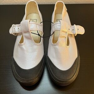 Vans White Slip-On Shoes with Black Soles